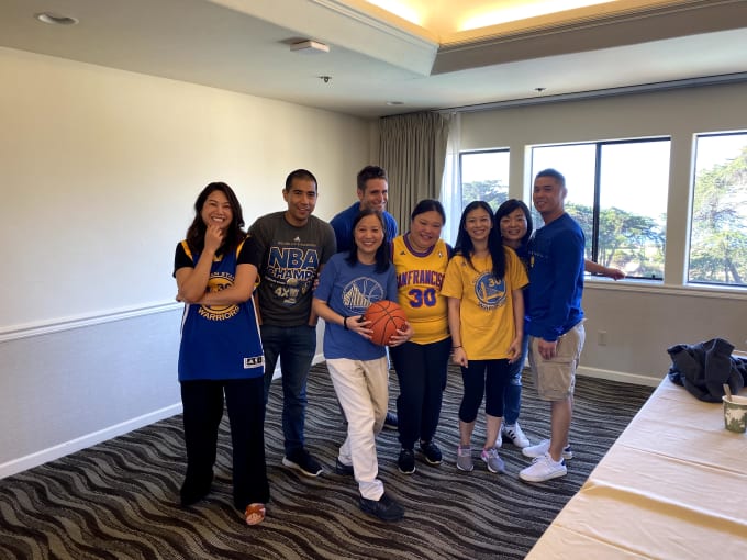 Hannah Yuan holds the basketball in the center of the photo. Go Warriors!